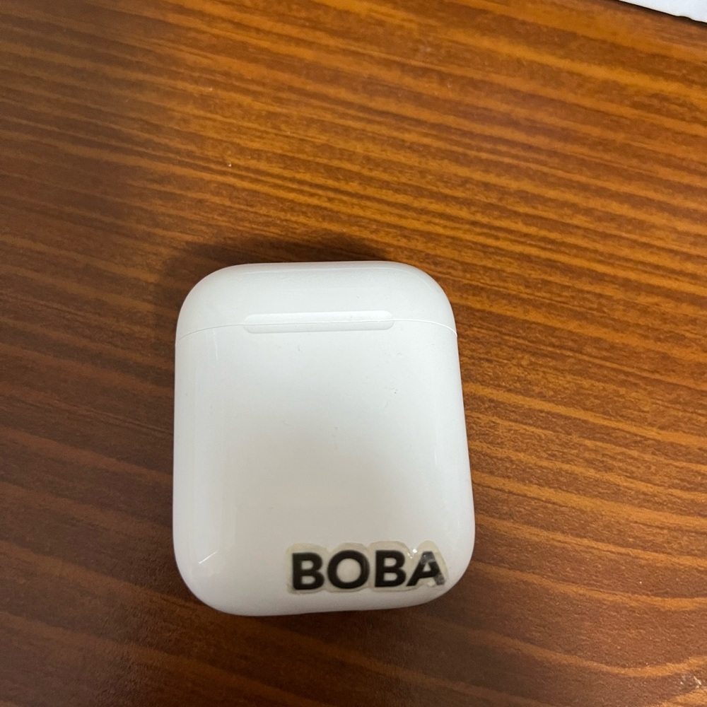 AirPod case and left AirPod